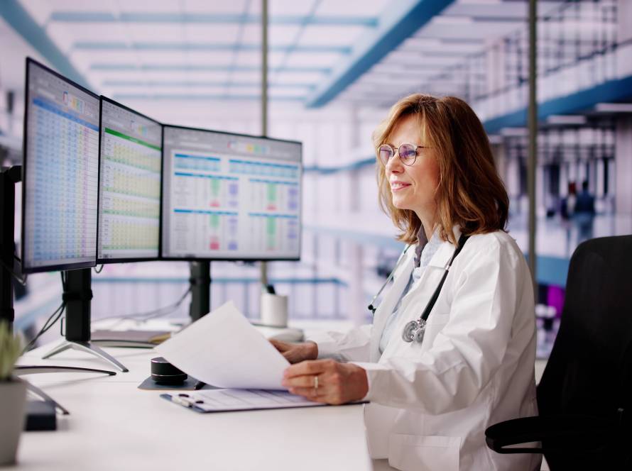 Doctor at a healthcare practice on the computer doing taxes