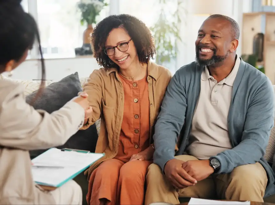 An older couple talking to a CPA about estate planning.
